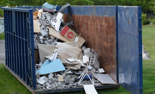 Professional home clearance team in Herne Hill clearing a living room